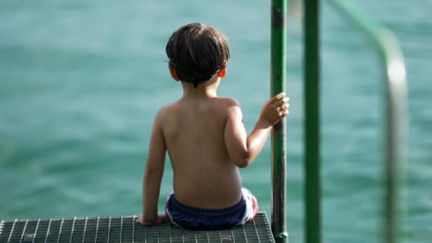 One Little Boy Sitting Pier Lake Back Wet Child Seated — Vídeos de Stock