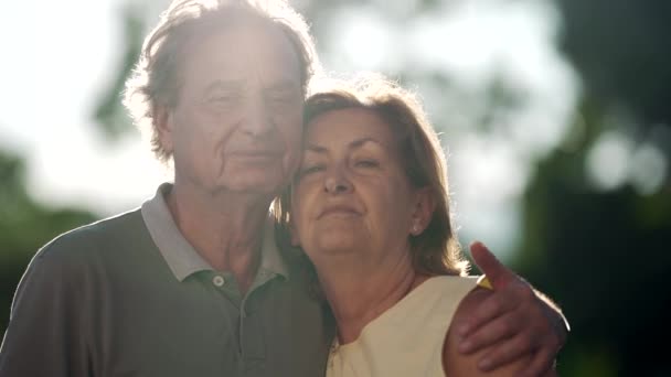 Happy Senior Couple Posing Camera Standing Nature Older Husband Embracing — Stockvideo