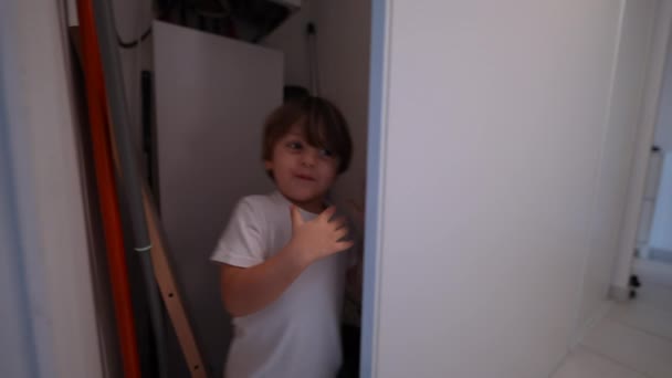 One Cute Little Boy Running Indoors Home Playing Hide Seek — Stockvideo