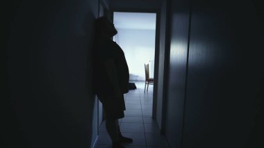 Person feeling lonely at home suffering from depression alone