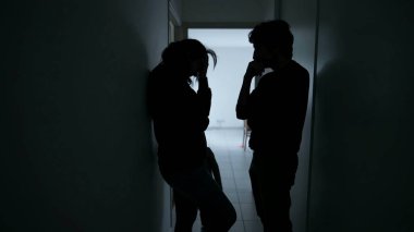 Couple fighting in front of child. Parents physically hitting each other. Domestic abuse concept. Man and woman fight discussing relationship