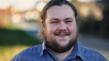 Closeup face of a positive casual male caucasian person with joyful expression