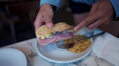 Hands preparing sandwich. Person making snack food to eat later