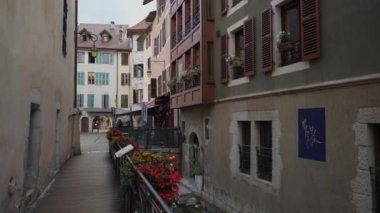 Charming traditional French street in Annecy. Old antique European architecture