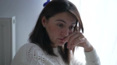 Skeptic Woman reacting with judgemental emotion in conversation with someone off camera. Surprised expression of female person speaking feeling disapproval