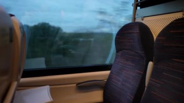 Passenger POV on train window while traveling 