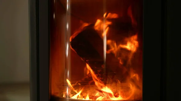Fire place burning. Wood burns inside chimney fireplace