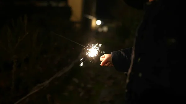 Child Hands Holding Fire Sparkler Celebrating Holidays —  Fotos de Stock