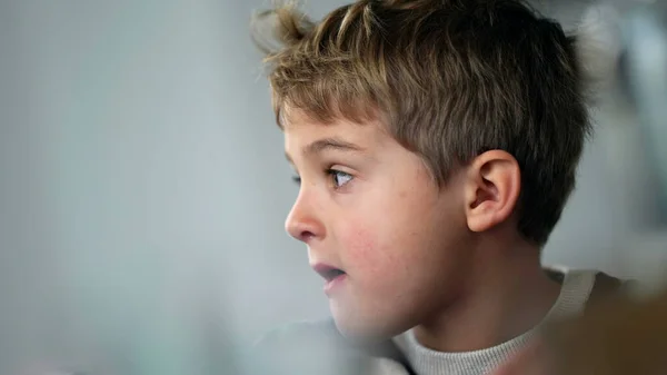 Candid Thoughtful Young Boy Closeup Face One Pensive Child Thinking — Stockfoto