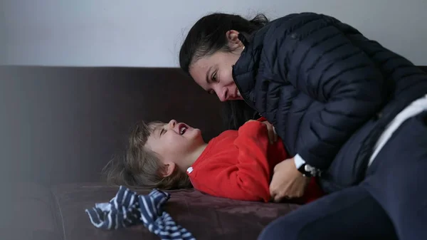Mother Tickling Little Boy Son Home Couch Candid Authentic Real — 스톡 사진