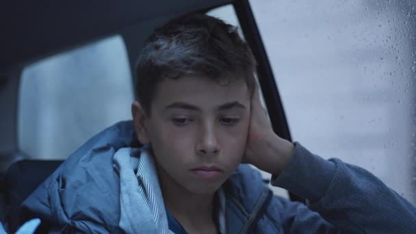 One Contemplative Young Boy Car Backseat Rainy Day Pensive Sad — Stok video