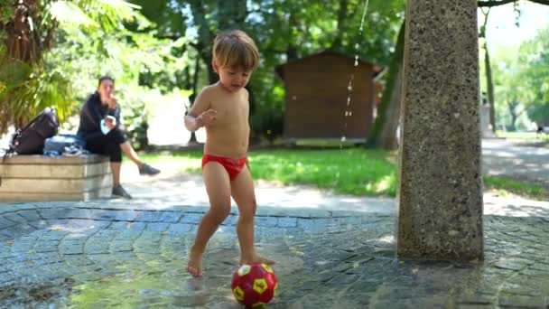 Child Standing Outdoors Park Heat Day Wearing Bathing Suit Briefs — Stock Video