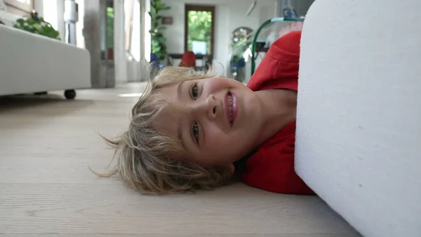 One Happy Small Boy Lying Floor Hiding Couch Modern Home — Stock Photo, Image