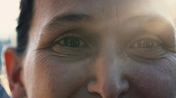 Extreme Close Woman Her 40S Eyes Turning Head Camera Sunlight — Stok Foto