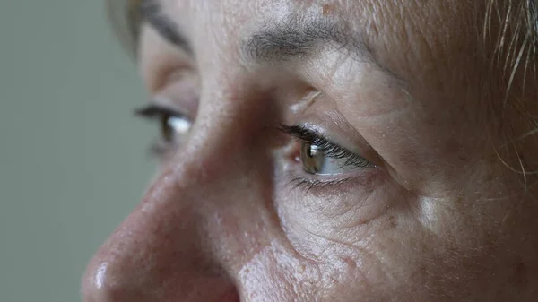 Thoughtful Senior Woman Contemplative Expression Macro Eyes Close One Mature — Stockfoto