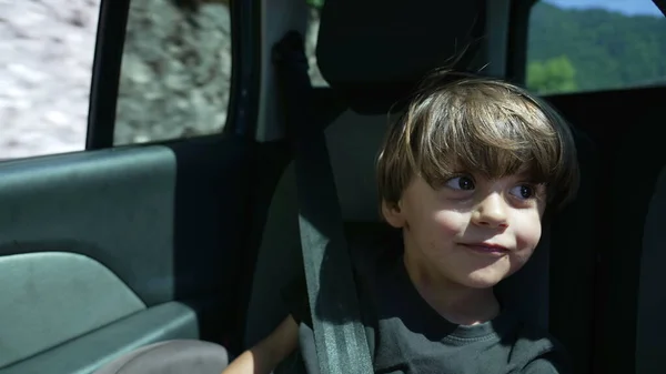 Joyful Kid Traveling Road Seated Car Backseat Wearing Seatbelt Small — Zdjęcie stockowe