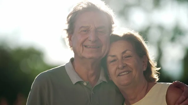 Happy Senior Couple Posing Camera Standing Nature Older Husband Embracing — ストック写真