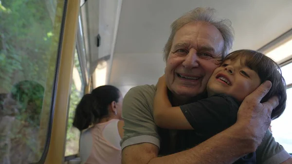 Grandfather Grandson Embrace While Traveling Train Grandparent Hugging Grandchild Railroad — Fotografia de Stock