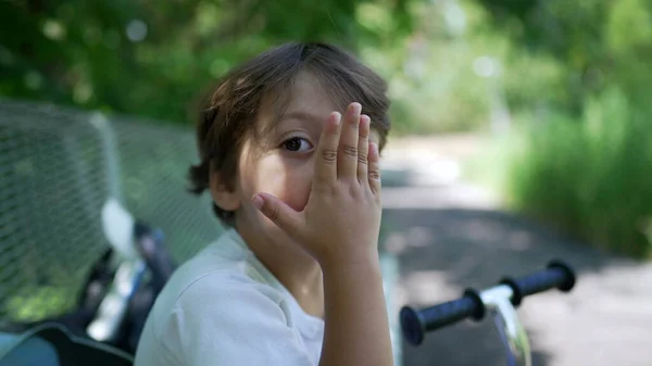 Little Boy Rubbing Nose Hand Seated Park Bench Kid Touching — Stock Photo, Image