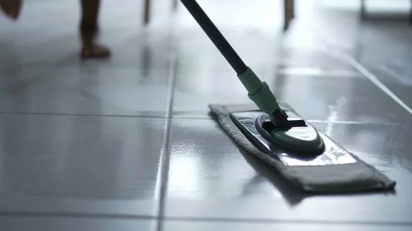 stock image Mop close up cleaning dirty floor at home