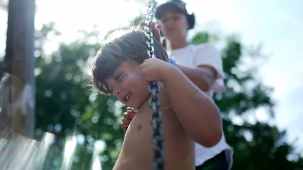 Child Playground Swing Mom Turning Twisting Child Little Boy Enjoying — Stok fotoğraf