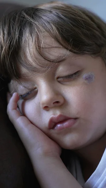 Stock image One small boy asleep during afternoon nap on couch. Closeup child face sleeping. Kid napping at home