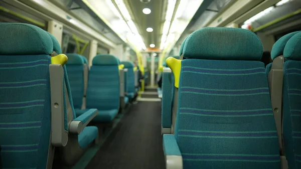Empty train seats with nobody. No passengers on public transportation
