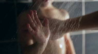 Showering small boy in slow motion. One caucasian male child shower bath routine