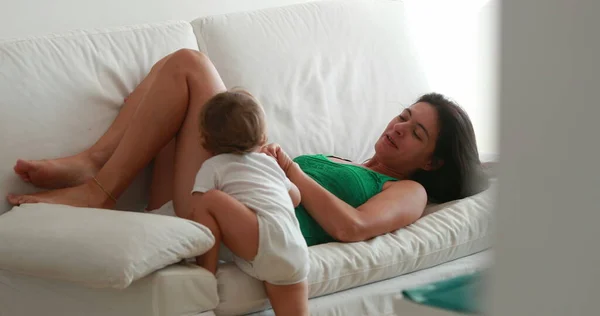 Casual Mother Baby Lying Sofa Candid Mom Toddler Indoors Home — 스톡 사진
