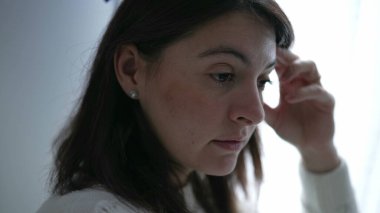 Displeased woman reacting with negative emotion scolding someone off camera. Judgemental female person