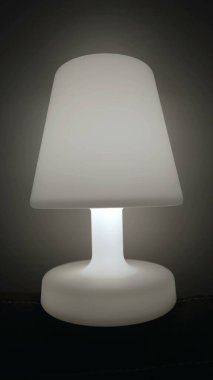 One Lamp glowing light in dark. Bedside nightlamp in Vertical Video