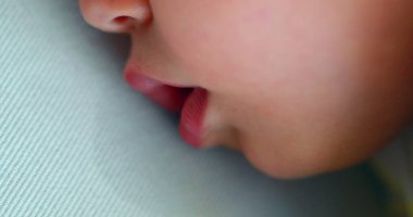 Cute baby sleeping drooling with mouth saliva