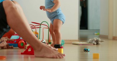 Little baby boy dancing moving body at home, happy child