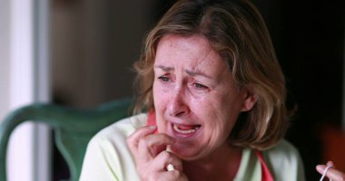 Older woman shock reaction with mood swings. Portrait of senior lady reacting with despair, laugh