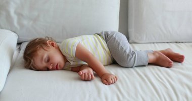 One year old baby sleeping. Infant boy toddler napping