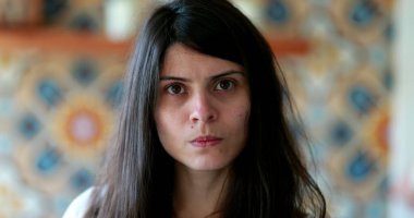 Upset woman looking at camera portrait. Judgemental attractive confident woman