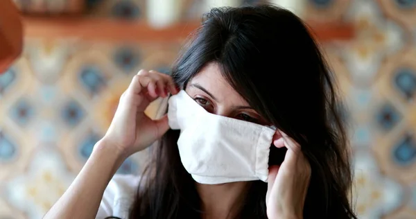 Brunette Woman Putting Surgical Face Mask Person Adjusting Pandemic Mask — стокове фото