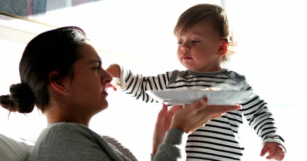 stock image Baby boy feeding mother food, funny toddler child feeds parent