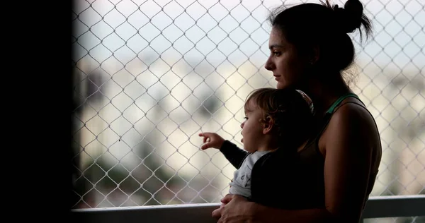 Pensive Mother Holding Baby Balcony Window Looking — Foto de Stock
