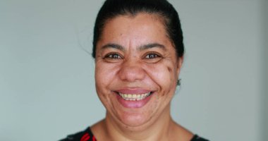 Portrait of African American black woman smiling to camera feeling happy and joy