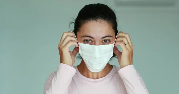 Girl Putting Face Mask Prevention Covid Pandemic Woman Wearing Mask — стоковое фото