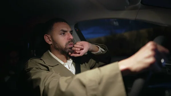 stock image Man driving at night in anxiety. Nervous pensive Middle Eastern male person driver on highway road