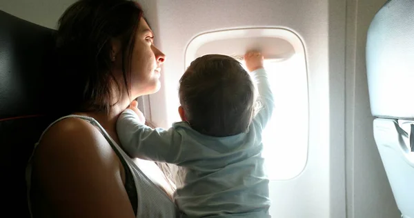 Baby Reaching Out Plane Window Mother Traveling Infant Son Child — Fotografia de Stock