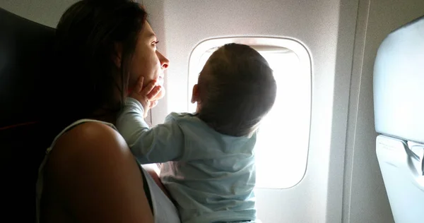 Baby Reaching Out Plane Window Mother Traveling Infant Son Child — Stok fotoğraf