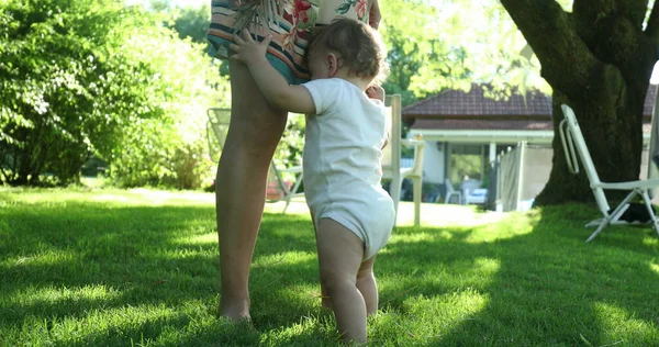 Adorable Toddler Baby Infant Holding Mother Leg Backyard Home — Photo