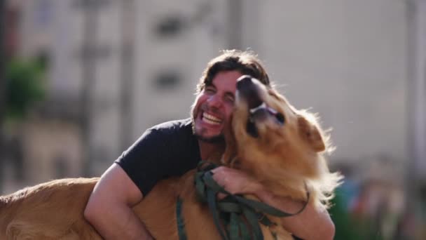 Happy Dog Owner Laughing Smiling While Hugging His Golden Retriever — Stock Video