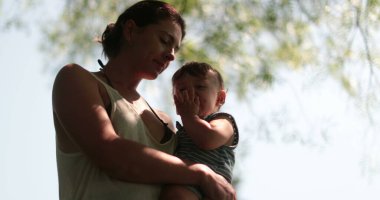 Baby and mother together in nature