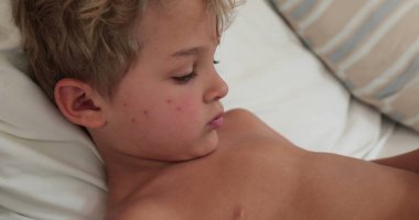 Child toddler using smartphone device, kid finger touching screen