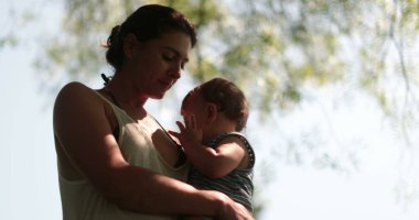 Baby and mother together in nature