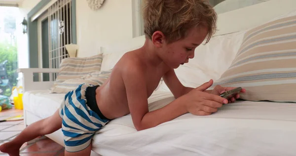 Casual Little Boy Child Using Cellphone Lying Sofa — 스톡 사진